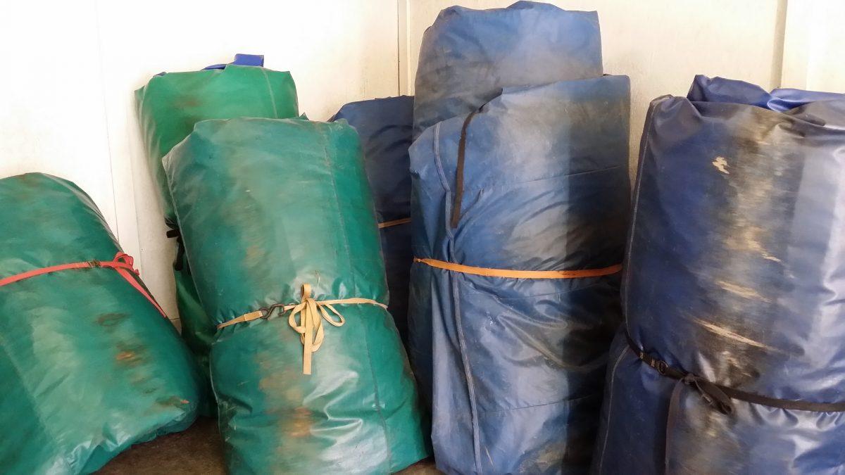 Bounce houses all rolled up.